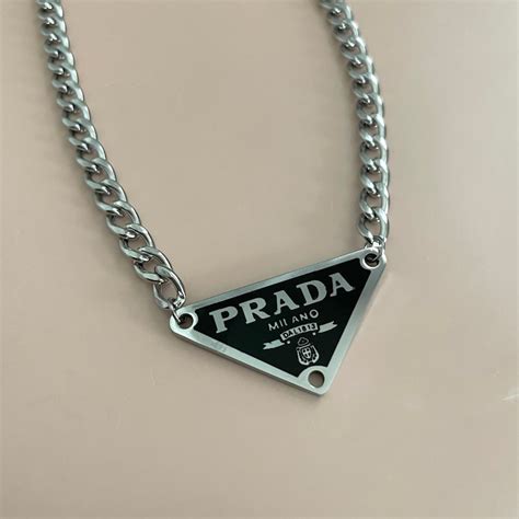 white triangle prada necklace|necklace with triangle pendant.